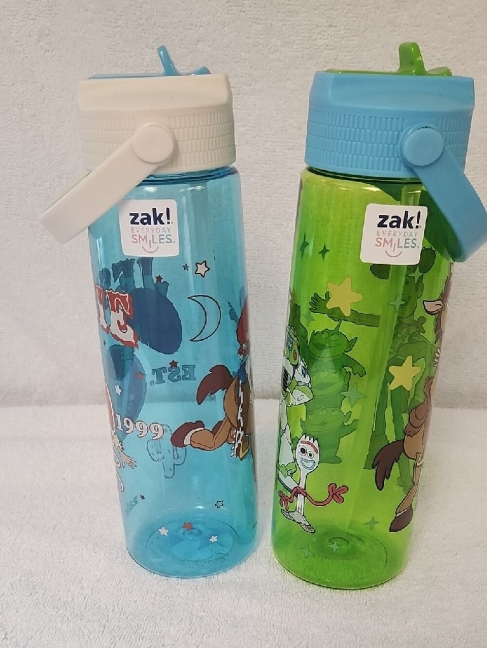 2 Kids' Toy Story Woody And Jessie Flip-Spout Water Bottles — Blue and Green - Picture 2 of 7